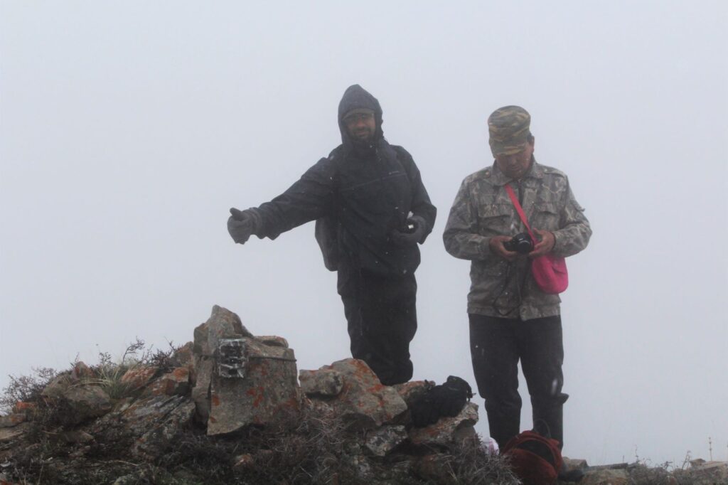 Setting up the camera trap with Amiel